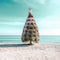 Christmas, Happy New year vacations concept. Holiday decorated tree with red balls and star on top standing on sandy