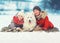 Christmas happy smiling family, mother and son child walking with white Samoyed dog in winter day, lying on snow
