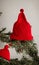 A Christmas Hat On A Branch, Its Red Color Popping In The Soft Morning Light. Generative AI