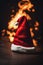 Christmas hat on fire on the floor, xmas background