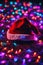 Christmas hat on the floor with bright lights around, xmas wallpaper