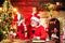 Christmas helper child writing letter to Santa Claus letter in red hat. Kid and and grandfather writting a christmas