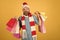 Christmas hipster shopper happy shout in santa hat and scarf