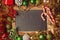 Christmas holiday background with blank chalkboard and Christmas decorations. Border design with copy space in the middle. Top..