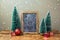 Christmas holiday decoration with chalkboard and snowman drawing on wooden table