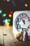 Christmas holiday eve. New year decor with bokeh lights. Magic Winter. Clock at midnight. Greeting new 2020 Year. Clock with
