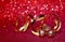 Christmas holiday red background, three small bells