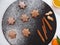 Christmas holiday star shaped gingerbread cookies for decoration with sugar powder, dark background, top