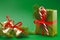 Christmas holiday wrapped gift box on green background