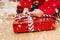 CHRISTMAS, HOLIDAYS AND CHILD CONCEPT, CLOSE-UP LITTLE BOY OPENING BOX GIFT OS SANTA CLAUS