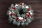 Christmas holidays wreath on dark wooden background. Winter holidays