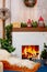 Christmas home decor. Fireplace and sleigh with warm blanket