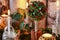 Christmas home decoration with pomander, candles, moss and paradise apples