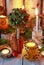 Christmas home decoration with pomander, candles, moss and paradise apples