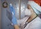 Christmas in the hospital: nurse doctor wearing Santa hat prepares the syringe for injection