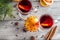 christmas hot mulled wine with cinnamon orange and anise on white wooden background