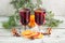 christmas hot mulled wine with cinnamon orange and anise on white wooden background