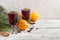 christmas hot mulled wine with cinnamon orange and anise on white wooden background