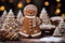 Christmas house, Christmas tree and gingerbread snowman on a background of festive golden bokeh. Ð¡hristmas baking, sweets. Hand