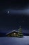 Christmas Illuminated hut in cold winternight