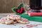 Christmas image of cookies on plate with cup of coffee.