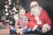 Christmas inspiration! Happy shocked boy surprised to see Santa