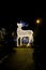 Christmas installation in the shape of a reindeer, blurred with sharp and film grain effect to make the photo look antiqued