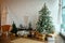 Christmas interior in the style of a Scandinavian loft: gray concrete, wooden decor, incandescent lamps, realistic artificial Chri