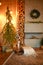 Christmas interior in the style of a Scandinavian loft: gray concrete, wooden decor, incandescent lamps, realistic artificial Chri