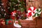 Christmas interior with wooden house, candy, tree and gifts. No people. Holiday background