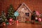 Christmas interior with wooden house, candy, tree and gifts. No people. Holiday background