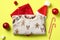 Christmas jumper and festive baby clothes with decorations on color background. Christmas party children outfit, fashion Xmas kids