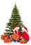 Christmas kids in Santa hat under xmas tree, open present gift box