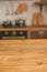 Christmas kitchen decor and copy space. Rustic kitchen in defocus. Wooden table in focus