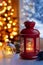 Christmas lantern by the window. Candle lantern on the windowsill. Evening lights under the tree.