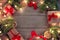 Christmas layout on wooden background, gifts, ribbons, christmas tree branches, garland lights, place for text