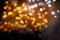 Christmas light from garlands of light bulbs, yellow bokeh, glow