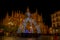 Christmas lights and decorations adorn the square of cathedral