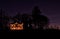 Christmas lights on a lone rural farmhouse