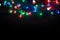 Christmas lights over black background