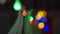Christmas lights, with unfocused circular colorful shapes and black background