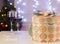 Christmas love background with two glasses of wine and present b