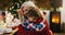 Christmas, love and a grandma hugging her grandchild in the home during the festive season together. Family, children or