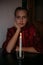 Christmas make wish, Russian Xmas traditions divination, fortune telling with candle. Portrait of young teenager girl