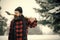 Christmas man with beard hold axe in winter forest