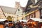 Christmas market blurred background, people walking in cozy decorated street