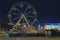 Christmas market on Saint Michael`s Square in Kyiv, Ukraine. Ferris wheel for little kids.