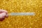 Christmas medical thermometer with a golden background