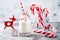 Christmas milk for Santa in bottle with straw and peppermint candy cane. Christmas holiday party drink