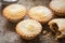 Christmas Mince pies with icing sugar .
